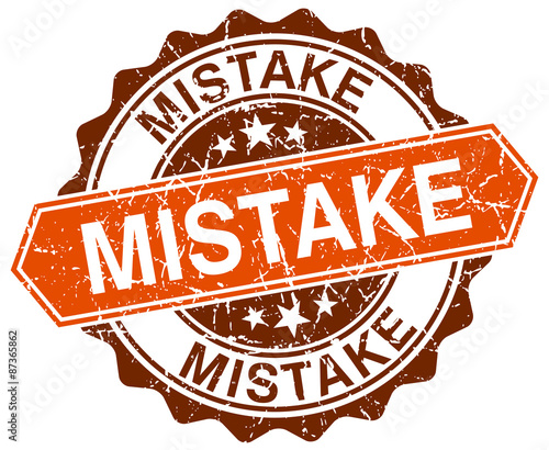 mistake orange round grunge stamp on white