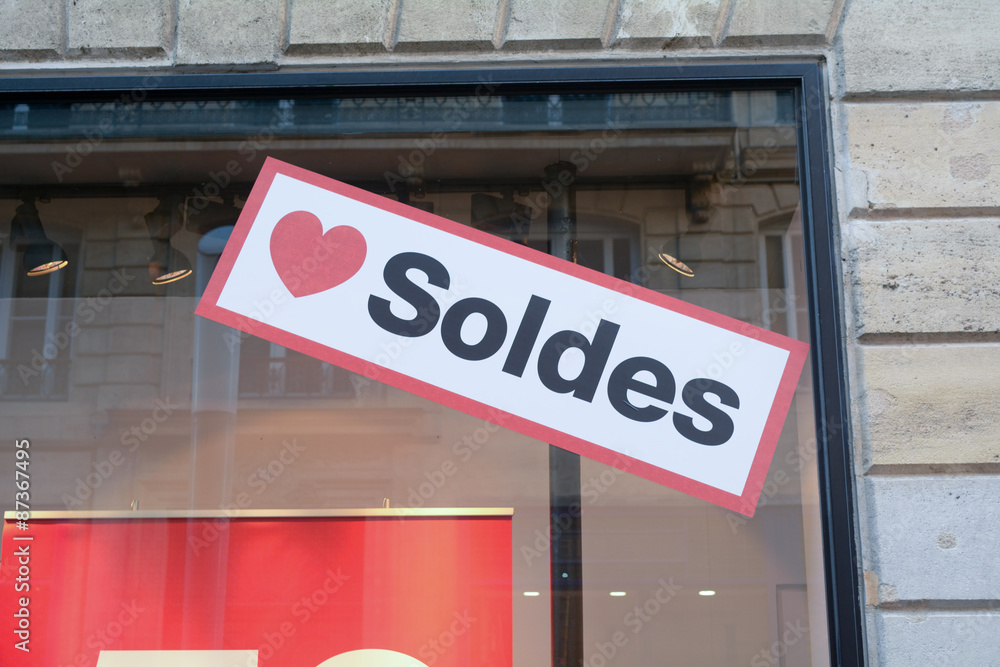Obraz premium Love Soldes sign in shop window in France