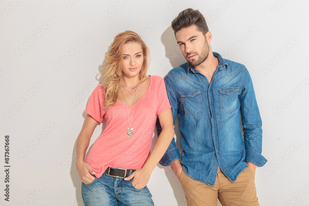 Casual couple looking at the camera Casual couple looking at the camera