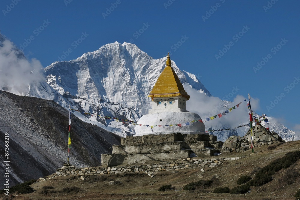 Stupa and snow capped mountain Thamserku