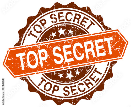 top secret orange round grunge stamp on white