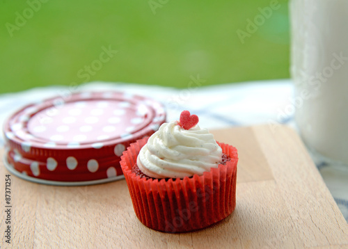 Redvelvet cupcakes with glass of milk