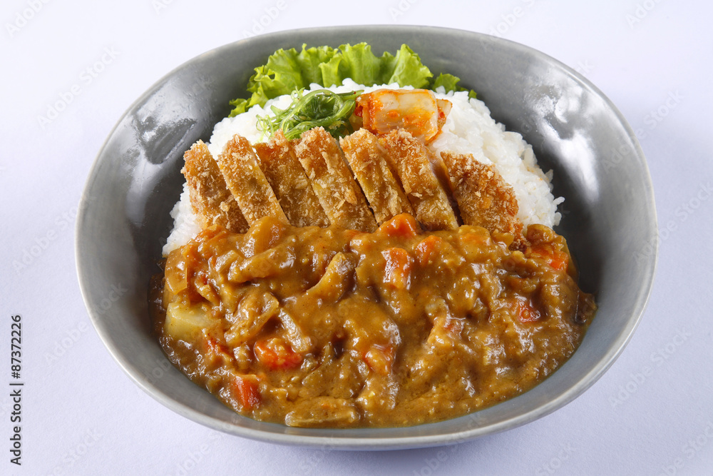 Deep fried pork with rice and curry sauce in japanese style - Tonkatsu Kare Deep fried pork with rice and curry sauce in japanese style - Tonkatsu Kare