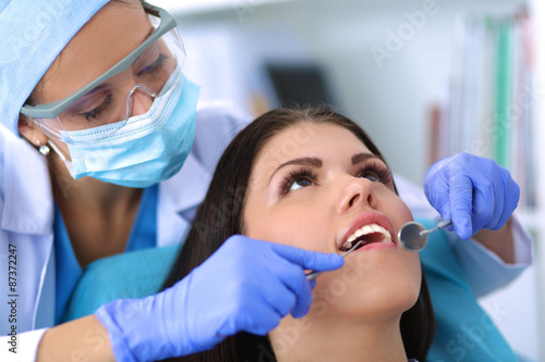 Woman dentist working at her patient amp amp amp  39 s teeth