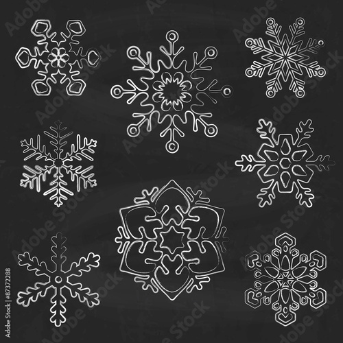 Snowflake silhouettes on chalkboard  background