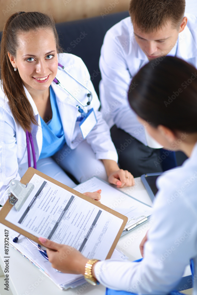 Happy medical team discussing and working together Happy medical team discussing and working together