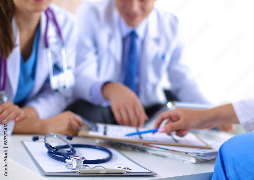 Happy medical team discussing and working together Happy medical team discussing and working together