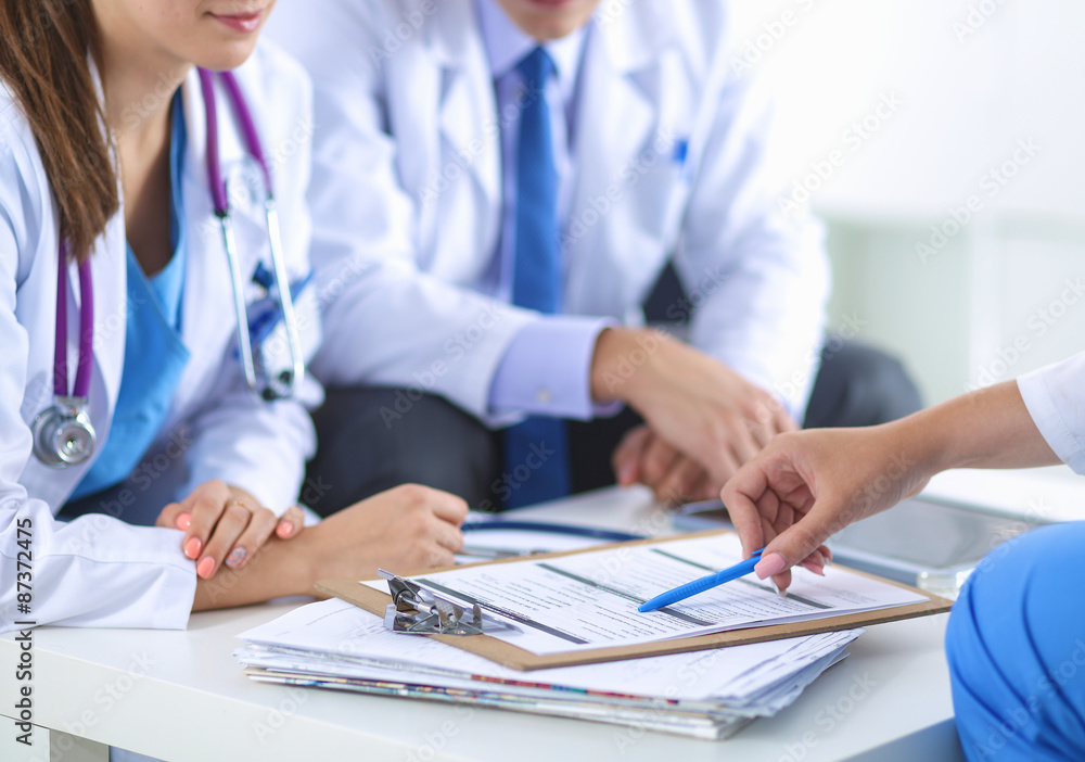 Happy medical team discussing and working together Happy medical team discussing and working together