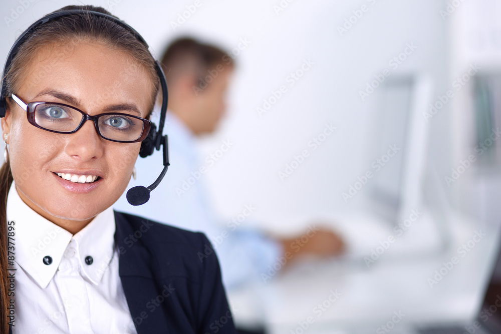 Happy female wearing headset and sitting on the desk Happy female wearing headset and sitting on the desk