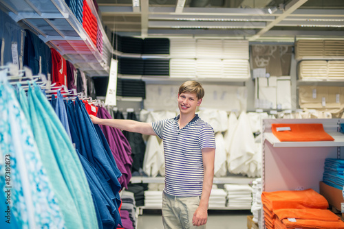 young man buys a towel photo