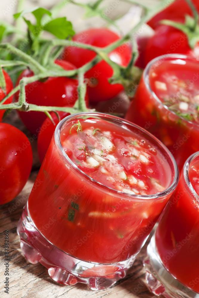 Traditional tomato soup gazpacho in a glass, selective focus Traditional tomato soup gazpacho in a glass, selective focus