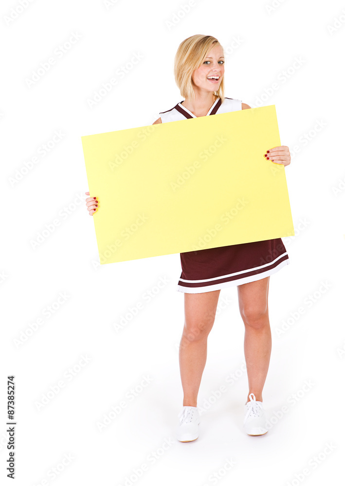 Cheerleader: Cute Young Woman Holds Up Blank Sign Cheerleader: Cute Young Woman Holds Up Blank Sign
