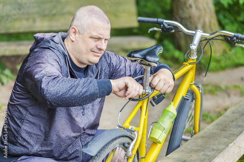 Man repairing bicycle