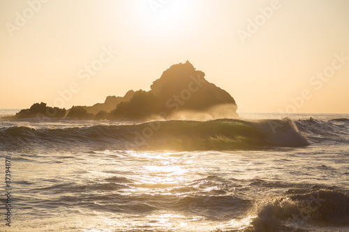 Photos Sun setting behind rocks at Pfeiffer State Park, Big Sur, California