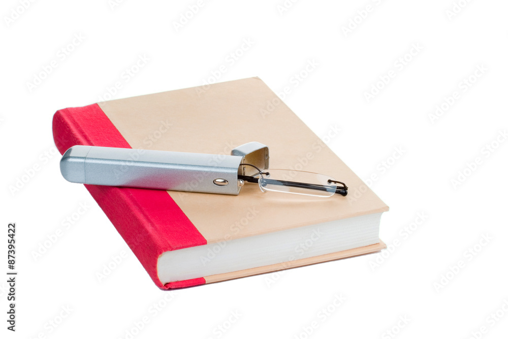 Eye glasses on a book, isolated on white background Eye glasses on a book, isolated on white background