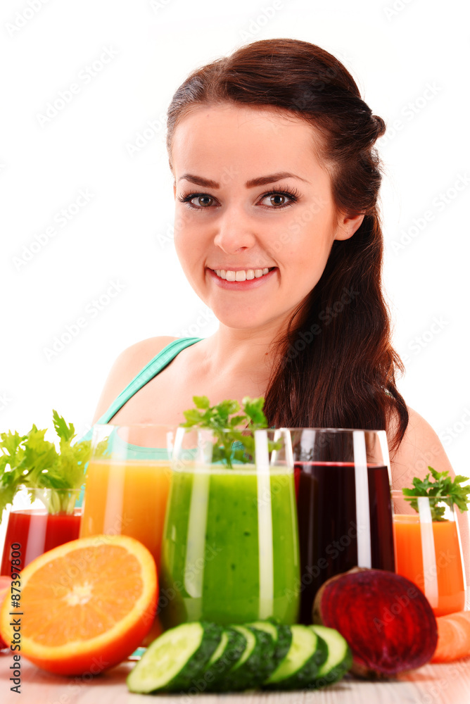 Young woman with variety of vegetable and fruit juices Young woman with variety of vegetable and fruit juices