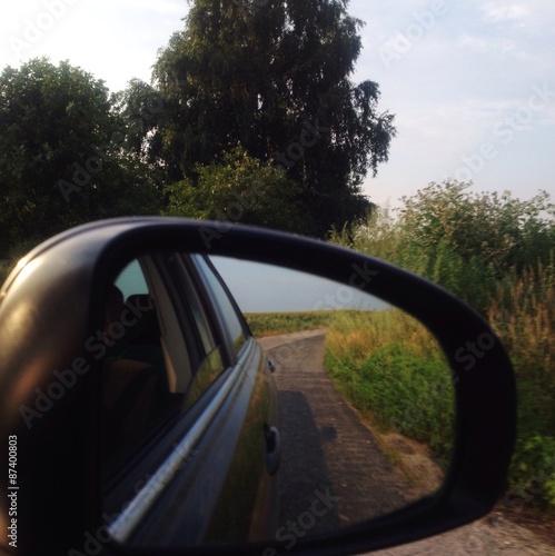 reflection in a car's mirror