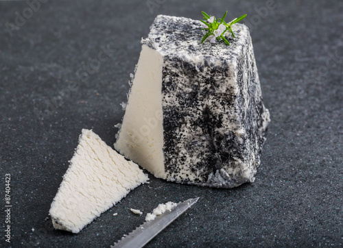 Goat cheese Valencay on a black background