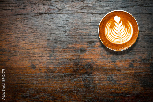 Coffee cup top view on dark wood table background with copy spac