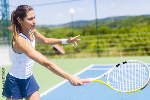 Obraz na plátně Beautiful female tennis player in action