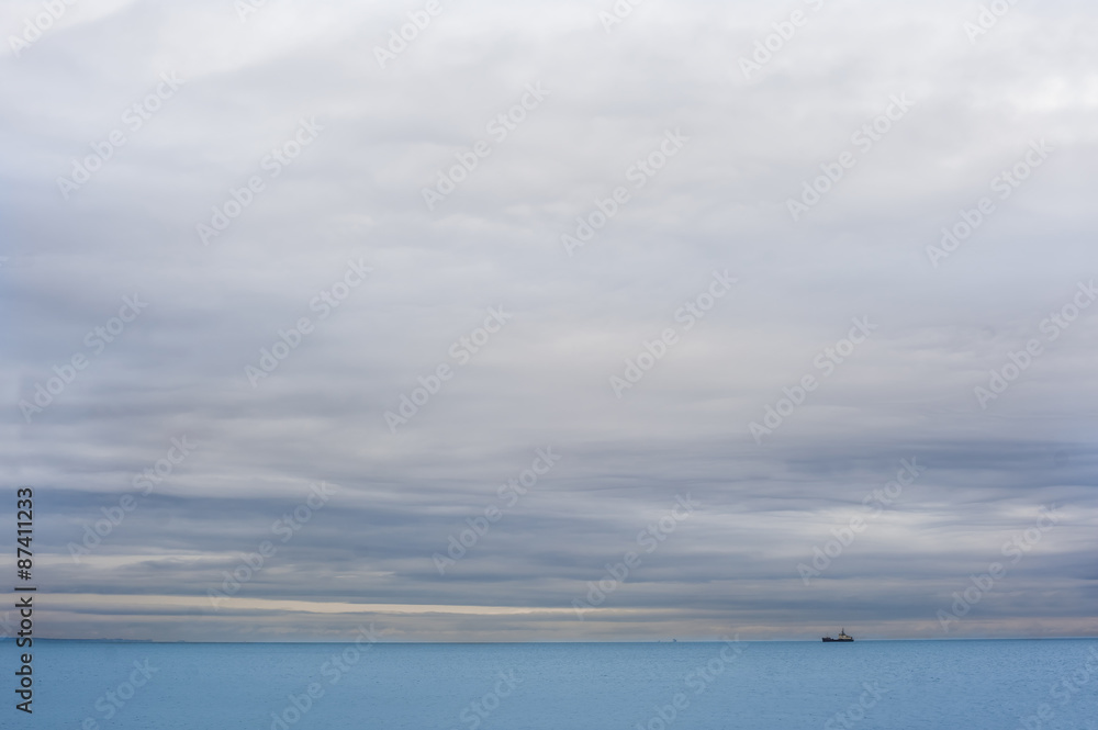 The ship on the cloudy horizon.