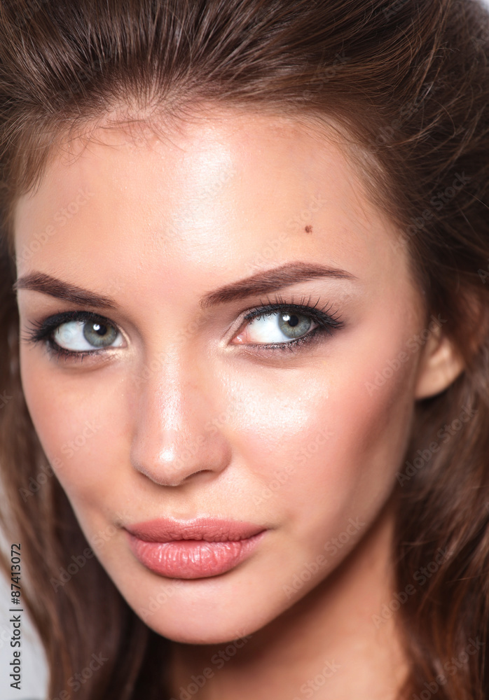 Close up portrait of beautiful young woman face. Isolated on Close up portrait of beautiful young woman face. Isolated on