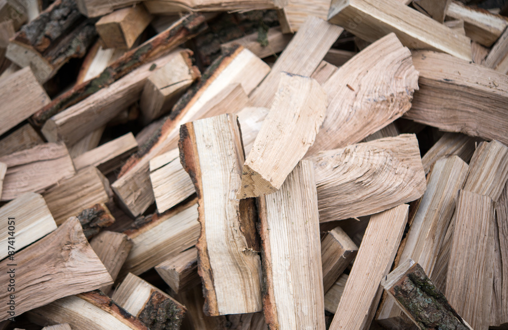 with a bunch of chopped firewood with a bunch of chopped firewood