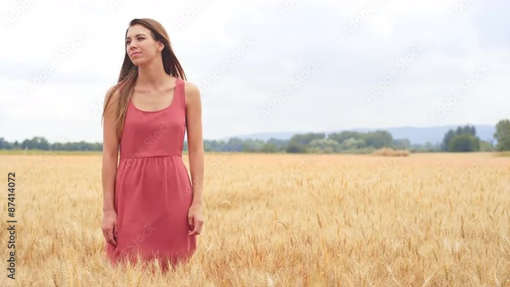 Beautiful Brunette Standing in a Wheat Field Beautiful Brunette Standing in a Wheat Field