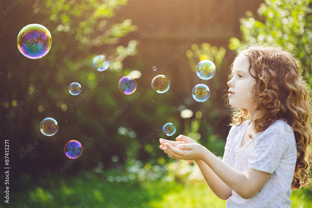 little girl catches soap bubbles little girl catches soap bubbles