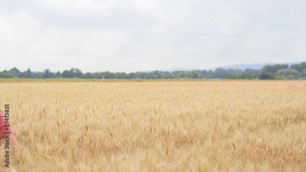 Beautiful Brunette Runs Through a Wheat Field Beautiful Brunette Runs Through a Wheat Field