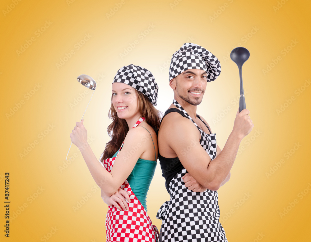 Pair of funny cooks against gradient Pair of funny cooks against gradient