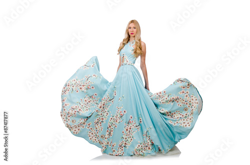 Woman in blue long dress with flower prints isolated on white photo