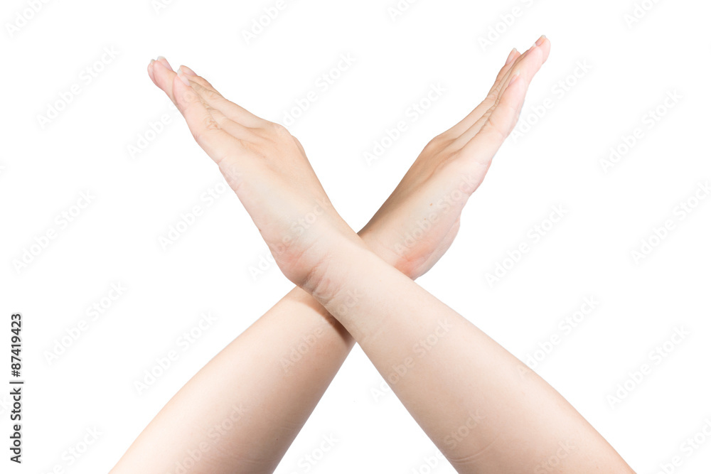 makes an X shape with his arms and hands. This could mean stop, cross, or makes an X shape with his arms and hands. This could mean stop, cross, or