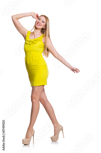 Pretty tall woman in short yellow dress isolated on white © Elnur