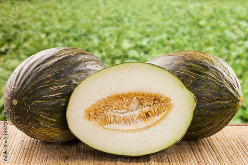 Quadro em tela Some melons over a wooden surface