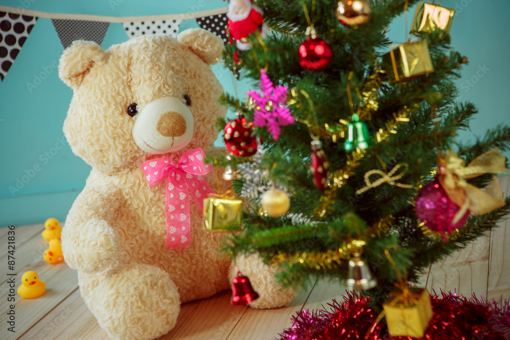 Bear with christmas tree on green background Bear with christmas tree on green background