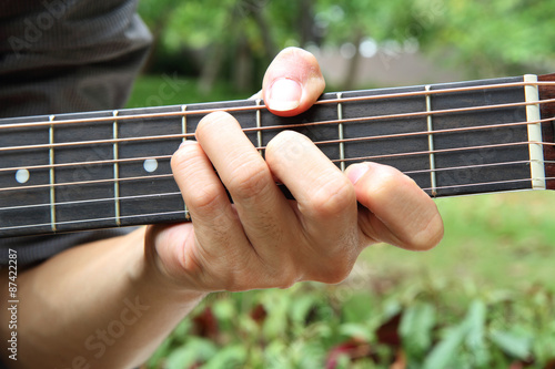 Obraz na plátně playing guitar chord F# / play guitar in the park