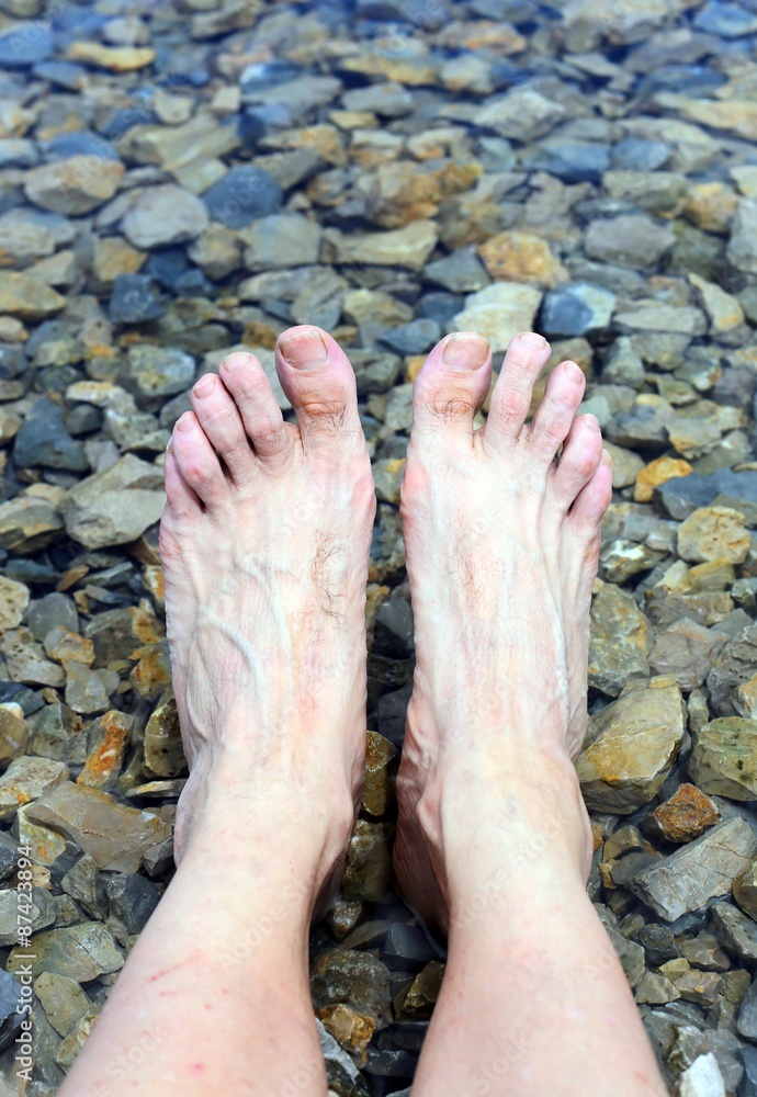 great relaxing feet on the shore of the Lake in the mountains great relaxing feet on the shore of the Lake in the mountains