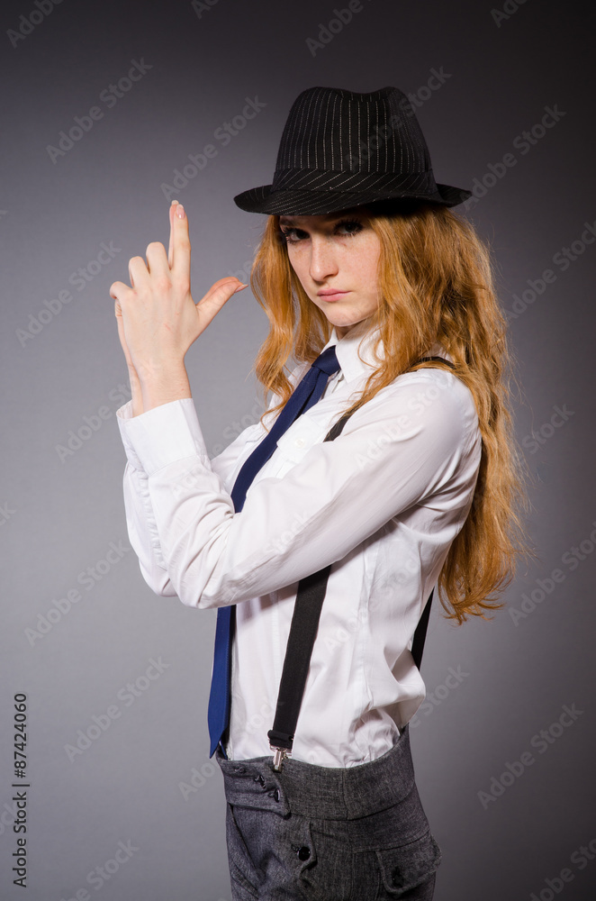 Pretty girl wearing black and white clothing isolated on gray Pretty girl wearing black and white clothing isolated on gray