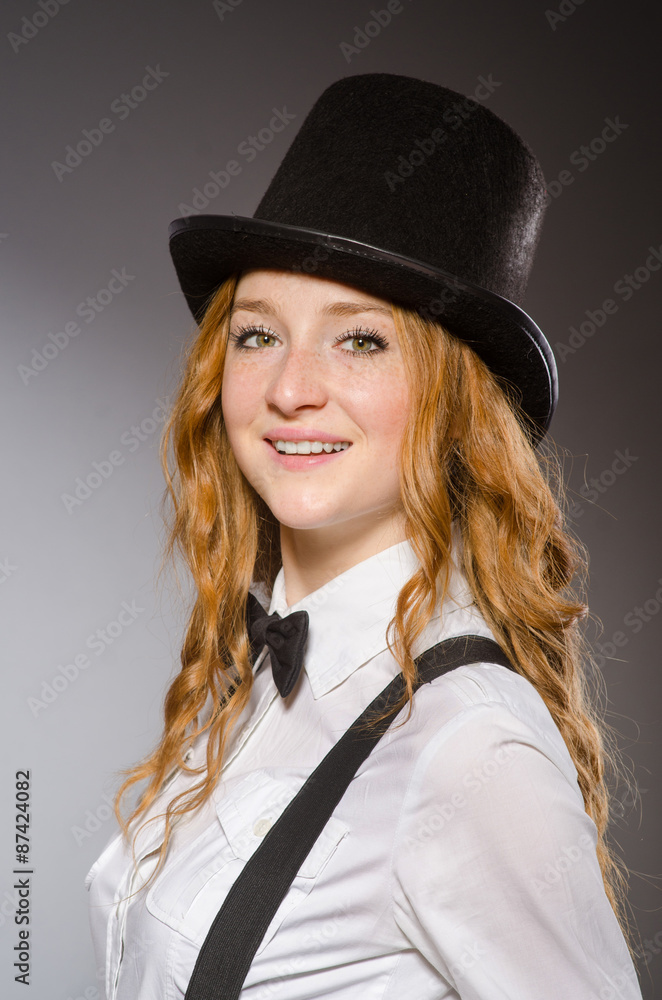 Pretty girl wearing retro hat isolated on gray Pretty girl wearing retro hat isolated on gray