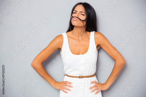 Beautiful woman making mustache