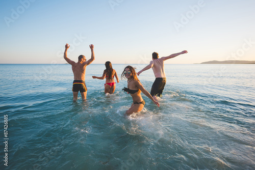 group of young multiethnic friends beach summer