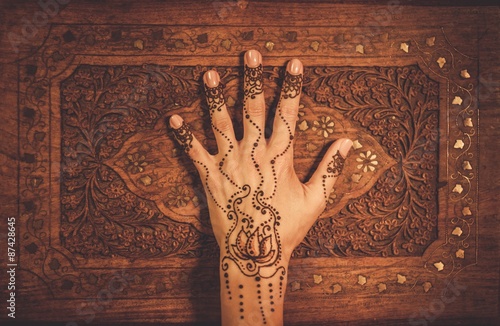 Woman's hand with traditional menhdi henna ornament photo