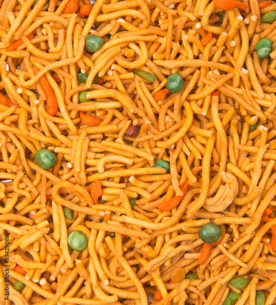 murukku or traditional indian snack on background. murukku or traditional indian snack on background.