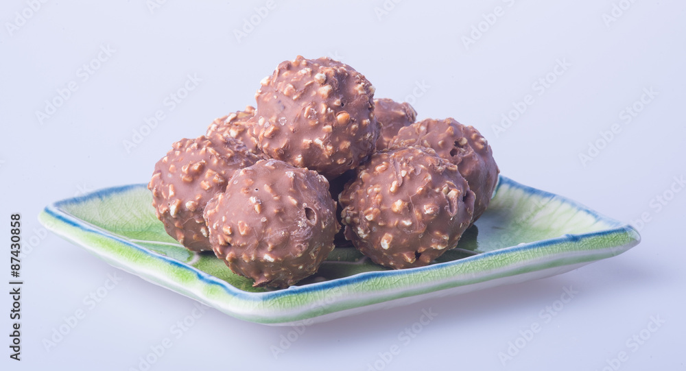chocolate ball or chocolate bonbon on a background. chocolate ball or chocolate bonbon on a background.
