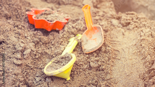 Obraz na plátně Plastic children toys in sandpit or on a beach