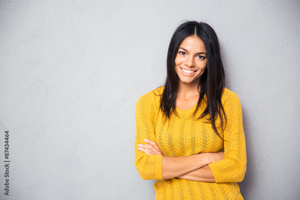 Happy girl standing with arms folded Happy girl standing with arms folded