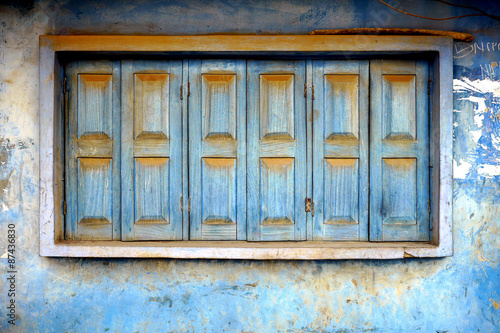 old shuttered blue windows