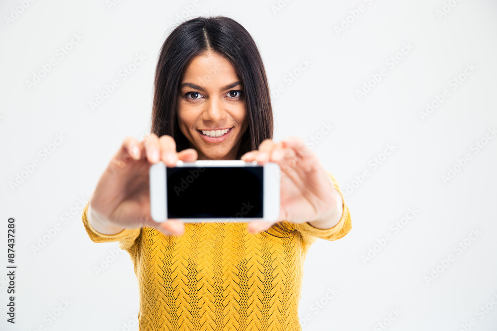 Smiling woman showing smartphone screen Smiling woman showing smartphone screen