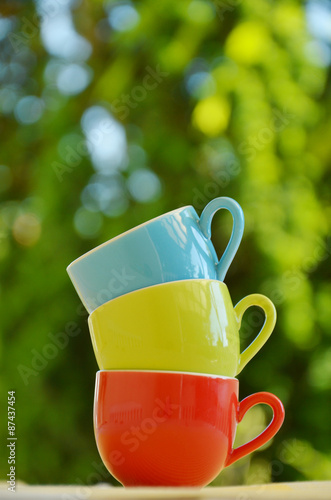 Stack of colorful mugs photo